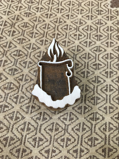 A lighted candle pottery stamp ceramic mold scrapbooking tjap batik printing floral carved stamps.